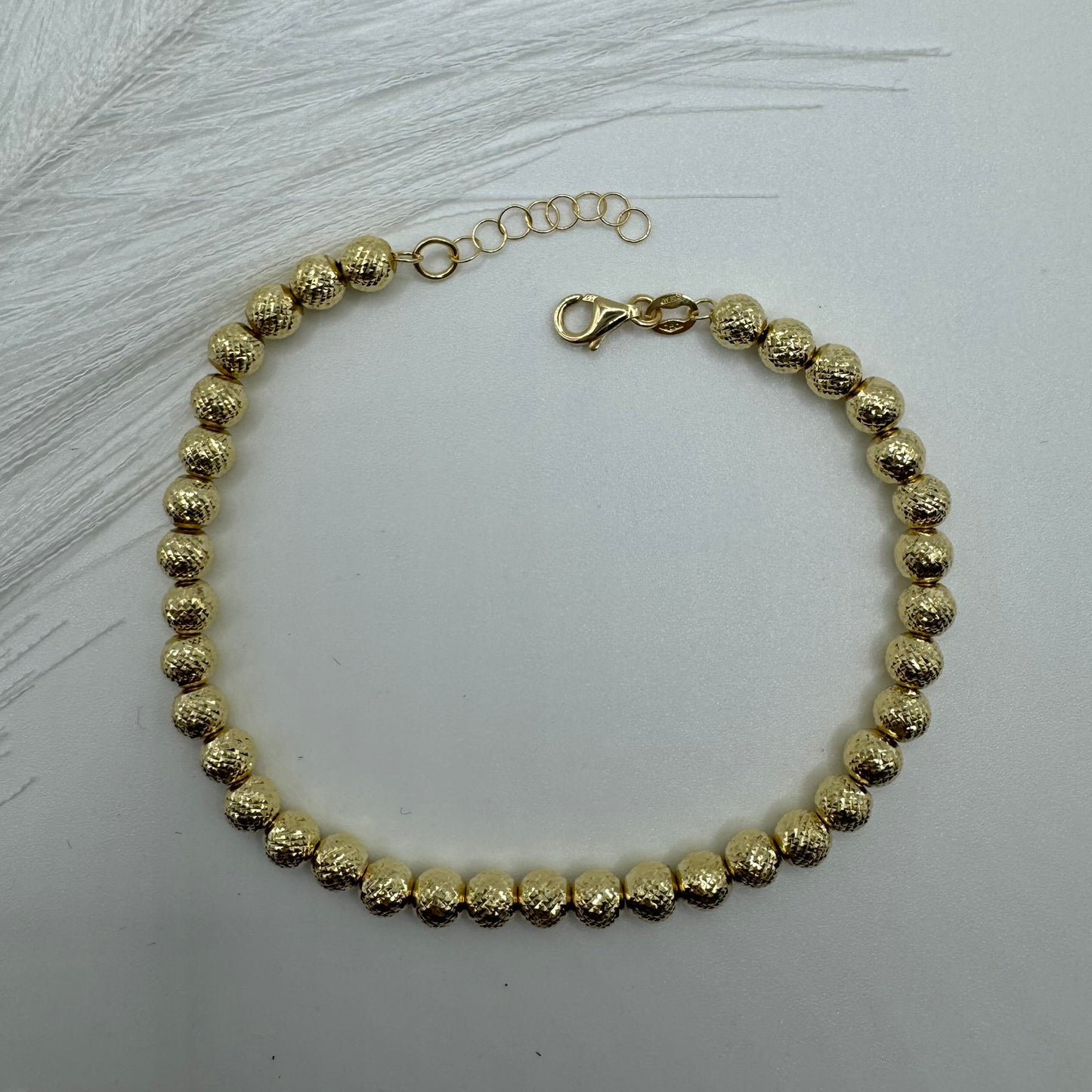 Bracciale sfere milleluci martellate oro
