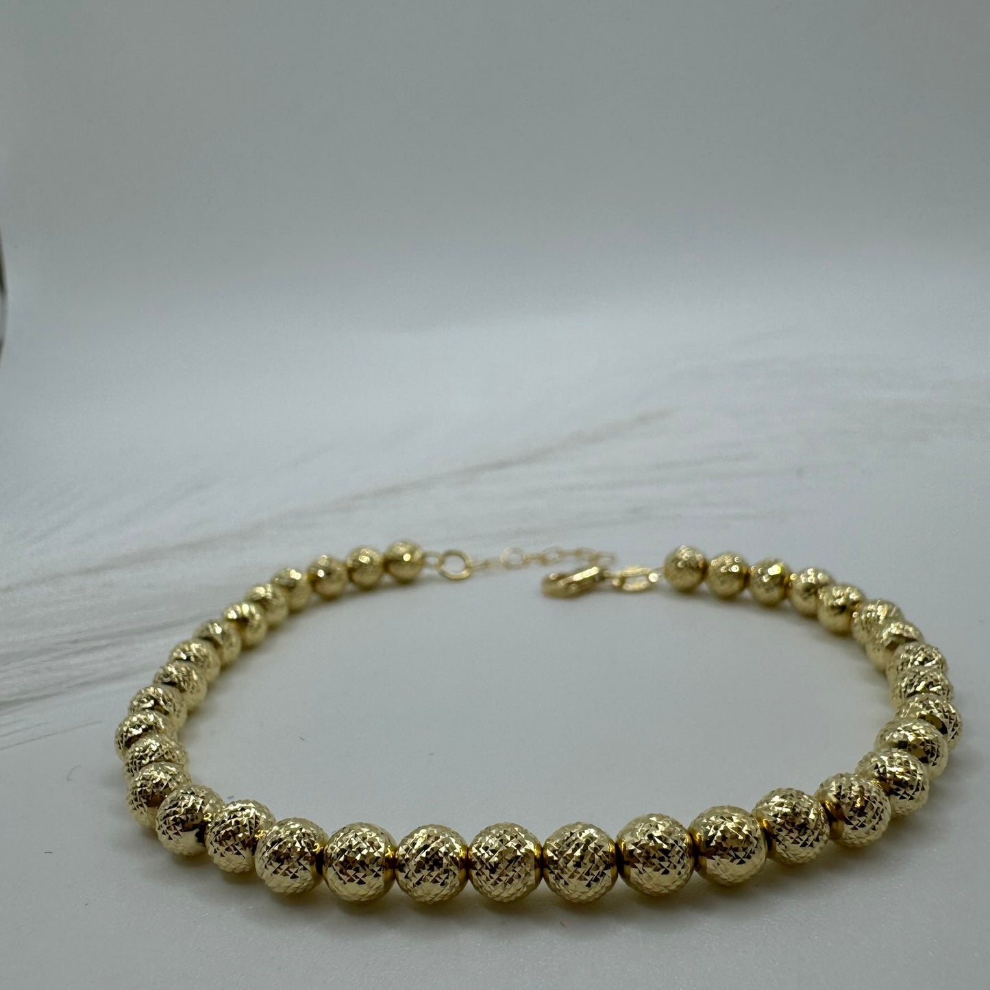 Bracciale sfere milleluci martellate oro