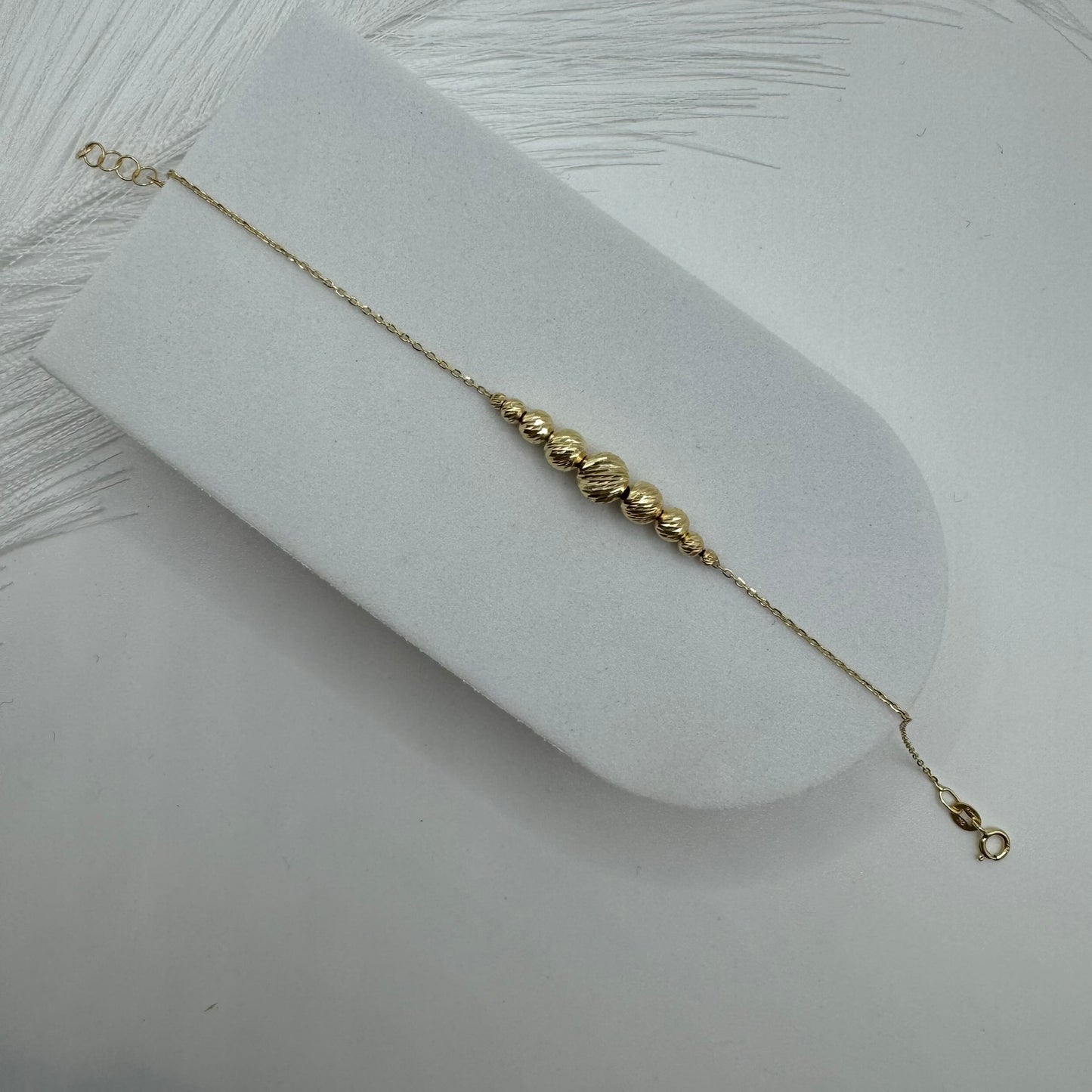Bracciale rollò con sfere sfaccettate oro