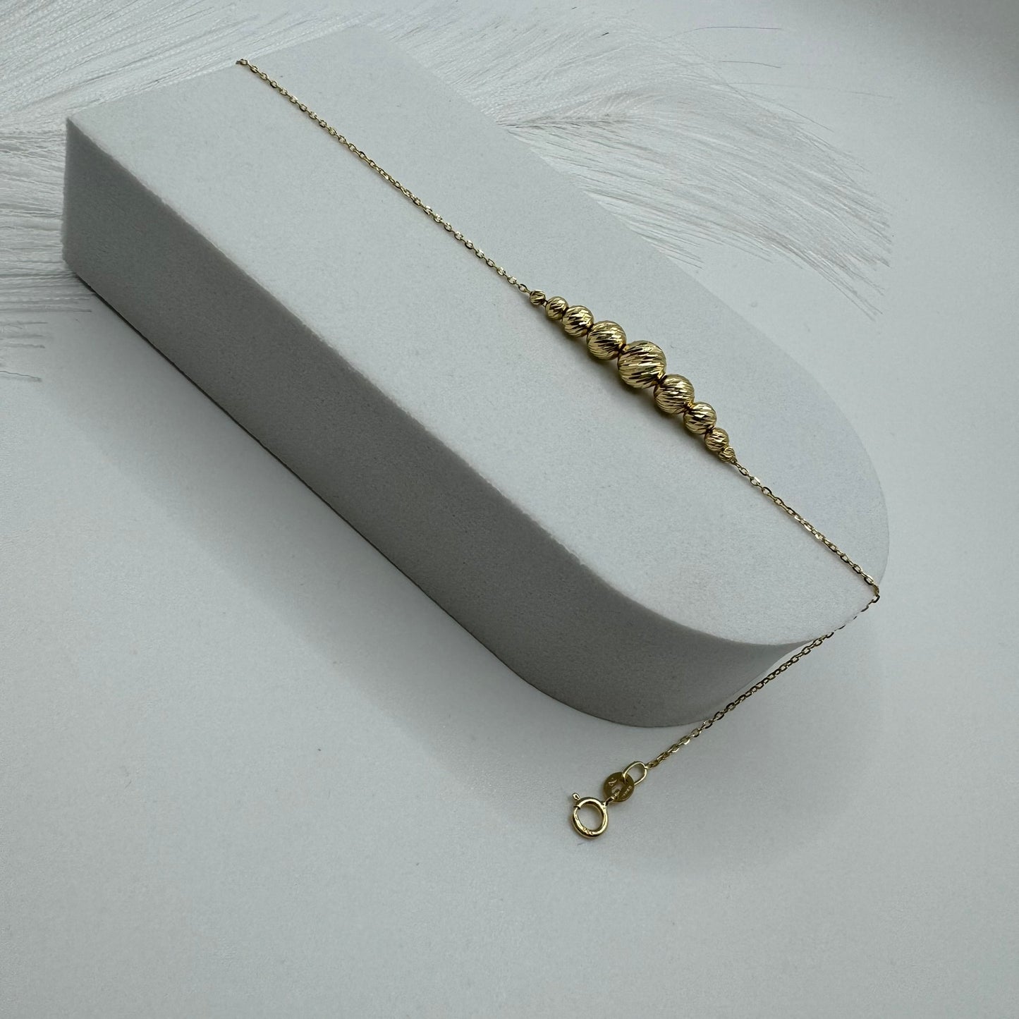 Bracciale rollò con sfere sfaccettate oro