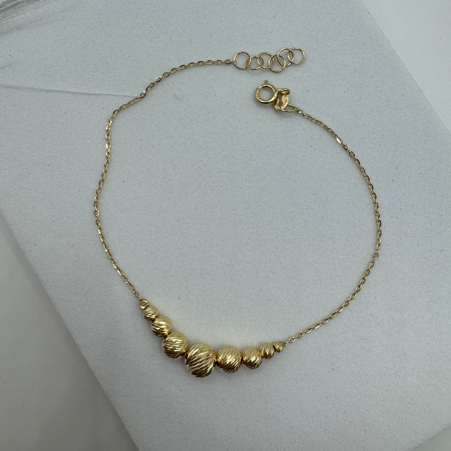 Bracciale rollò con sfere sfaccettate oro