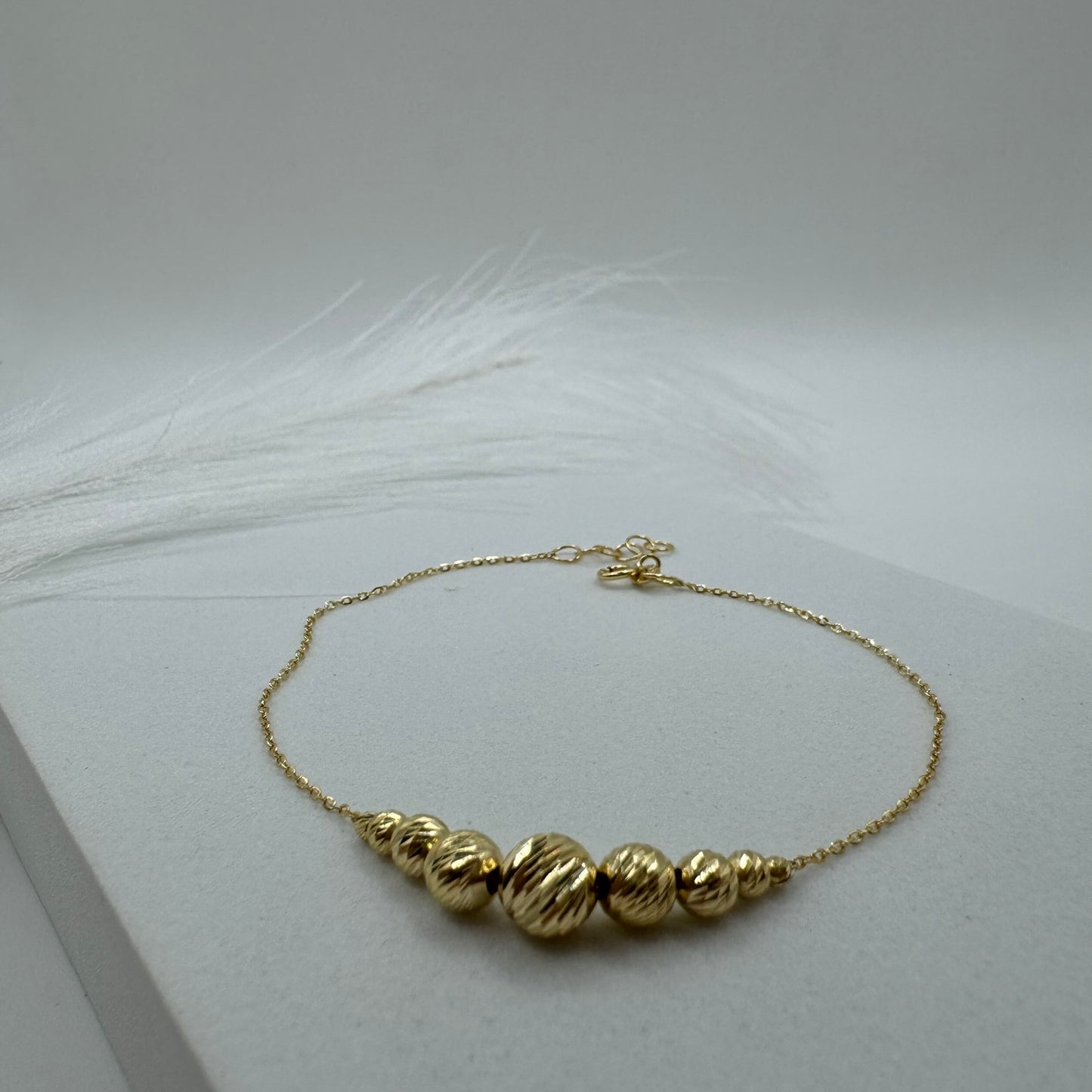 Bracciale rollò con sfere sfaccettate oro