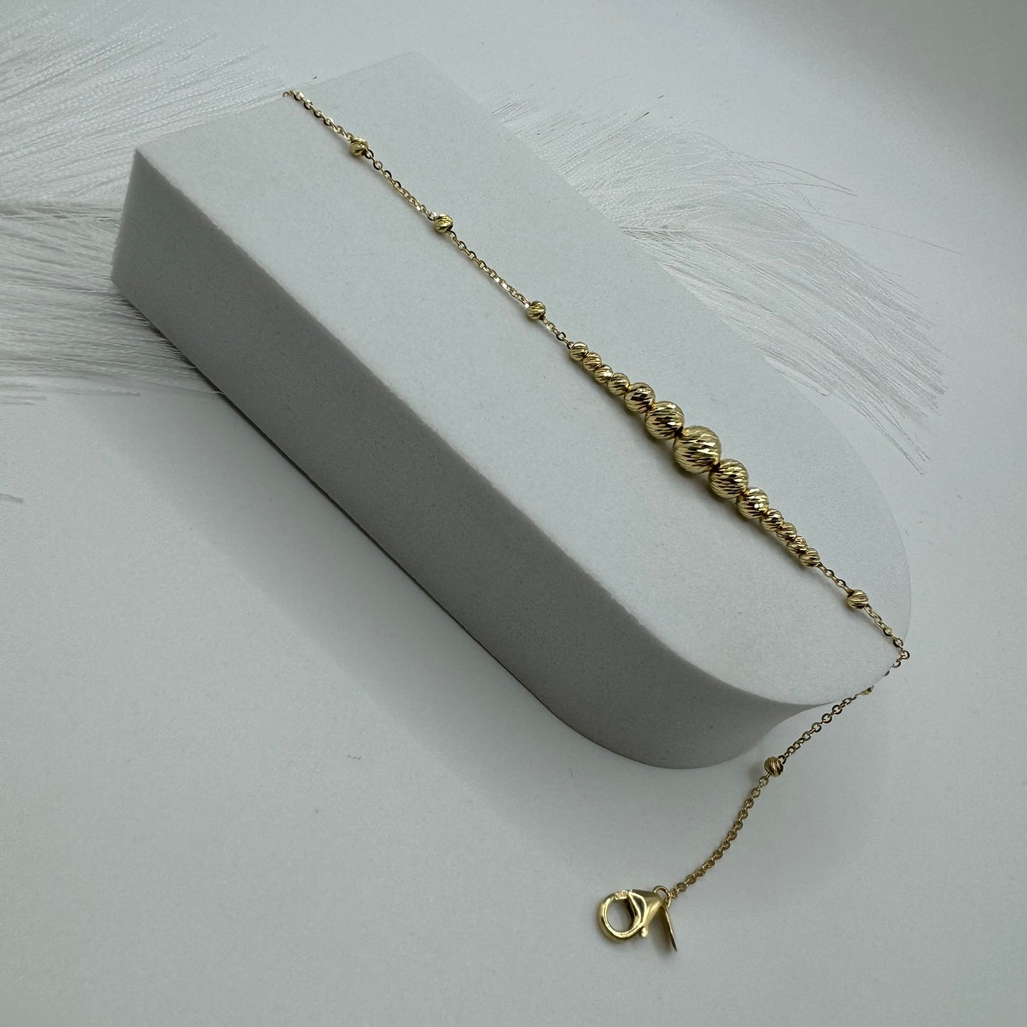 Bracciale rollò con sfere sfaccettate oro