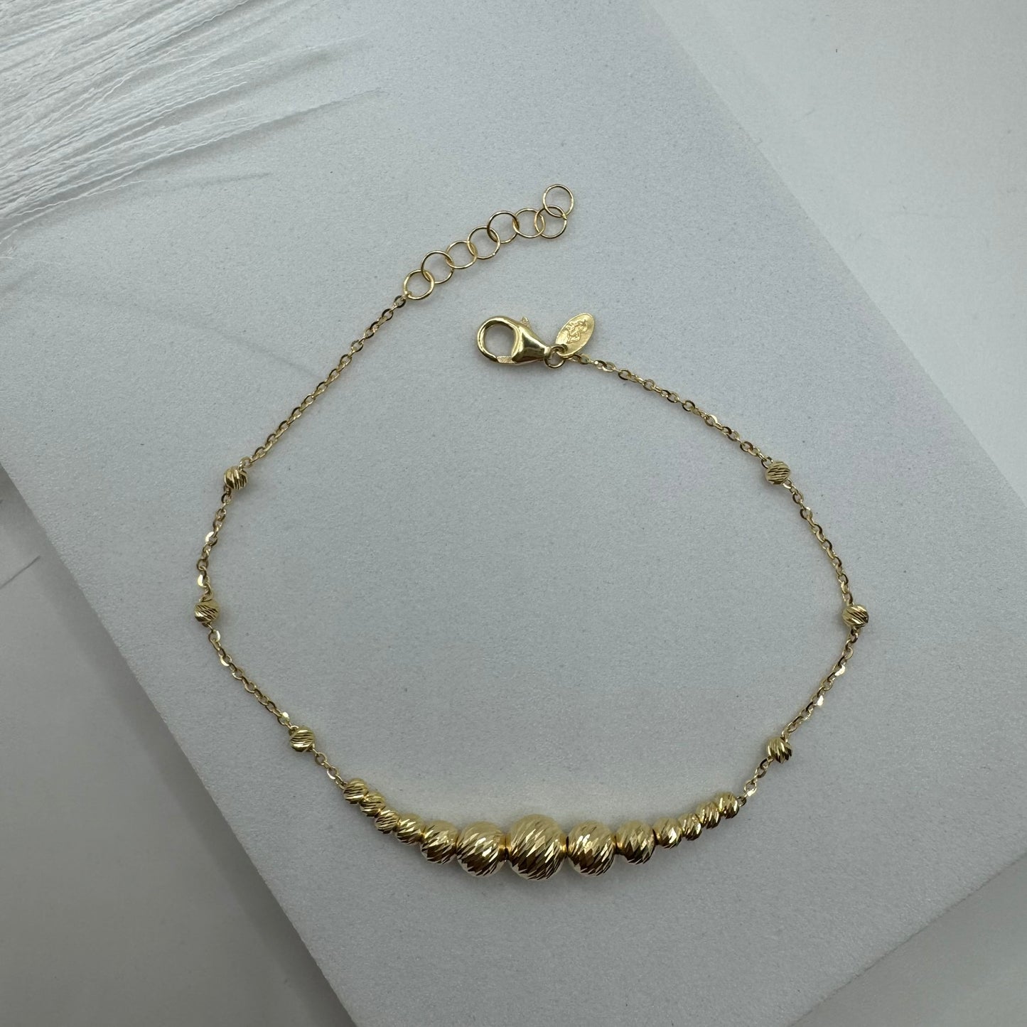 Bracciale rollò con sfere sfaccettate oro