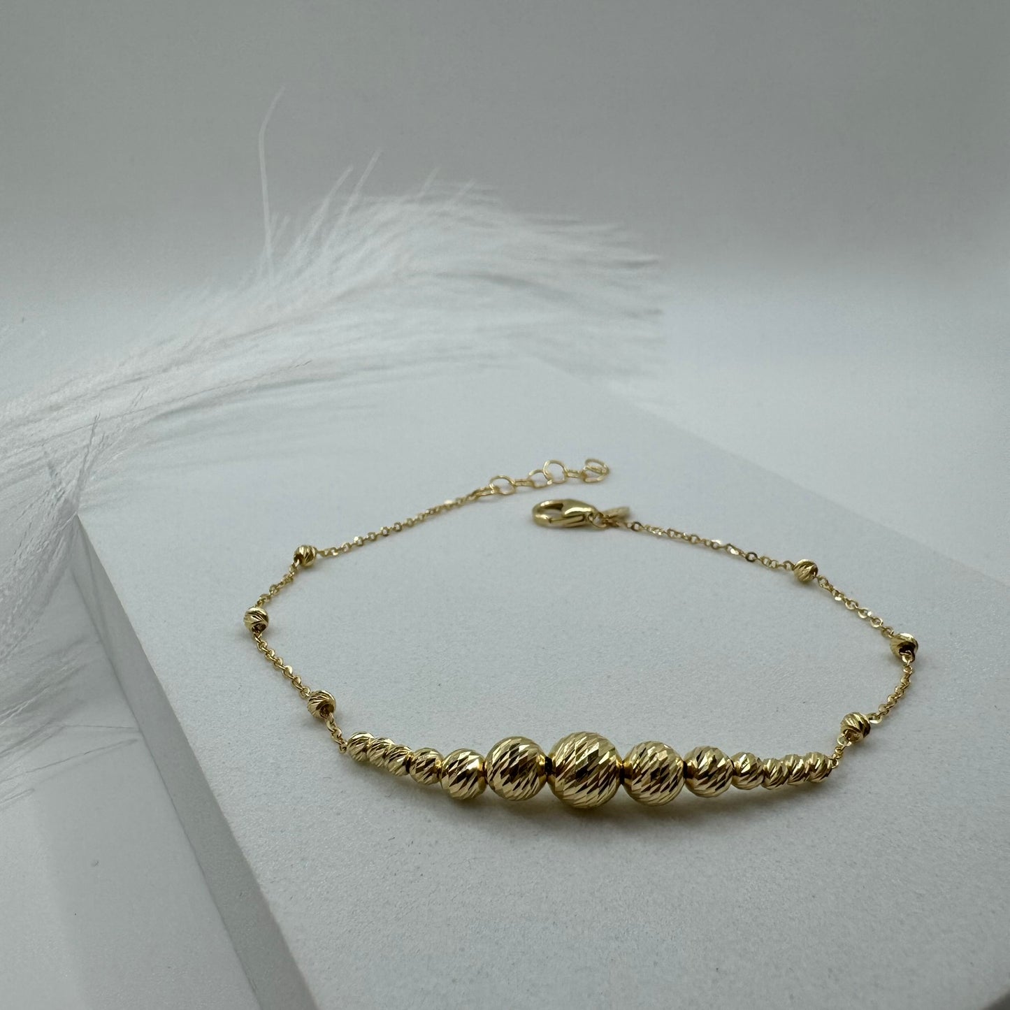 Bracciale rollò con sfere sfaccettate oro