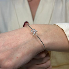 Bracciale rigido con lettera oro e diamanti