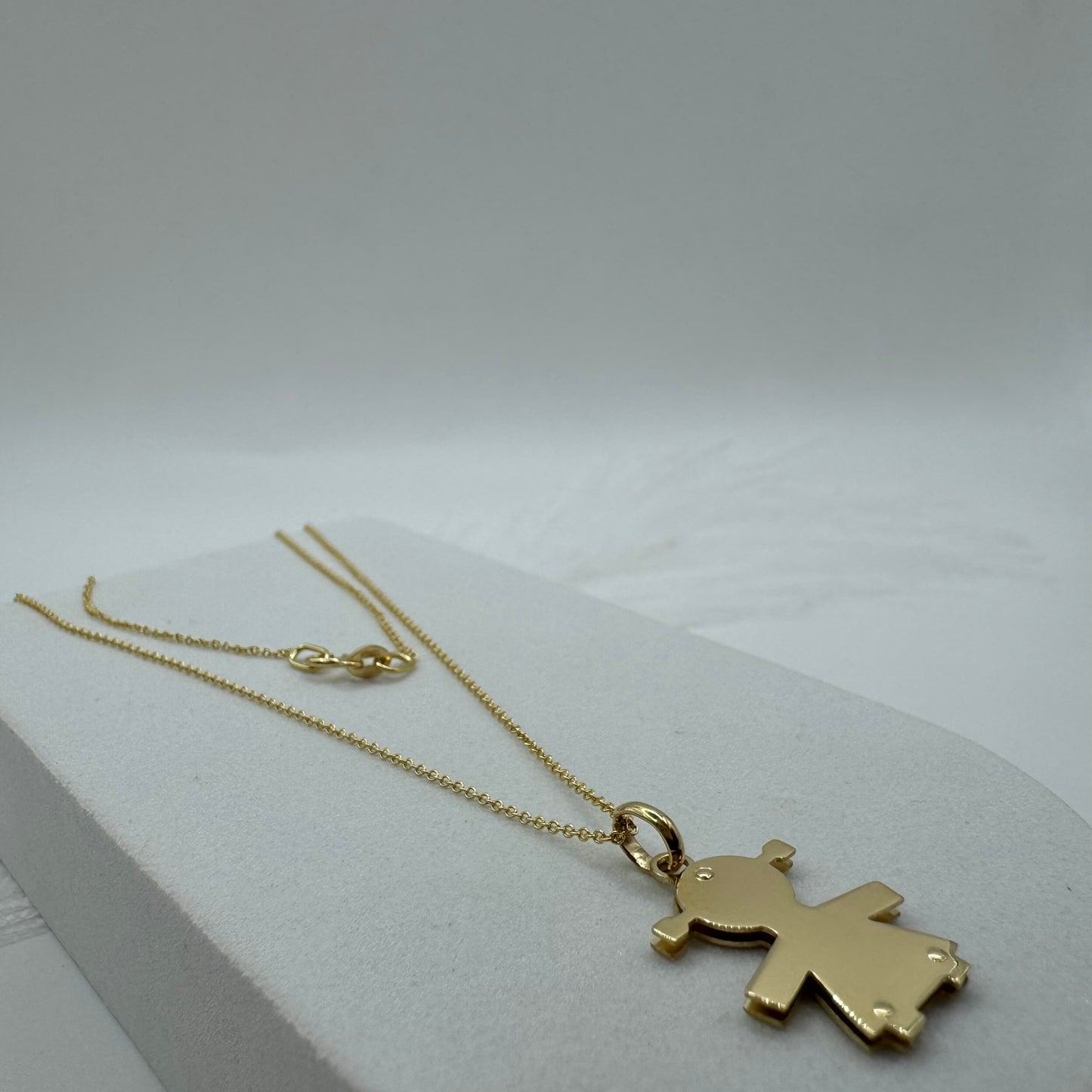 Collana rollò con bimba oro
