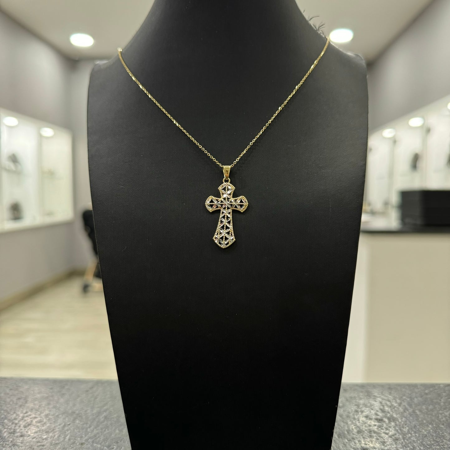 Collana rollò con croce foglie bicolor oro e zirconi