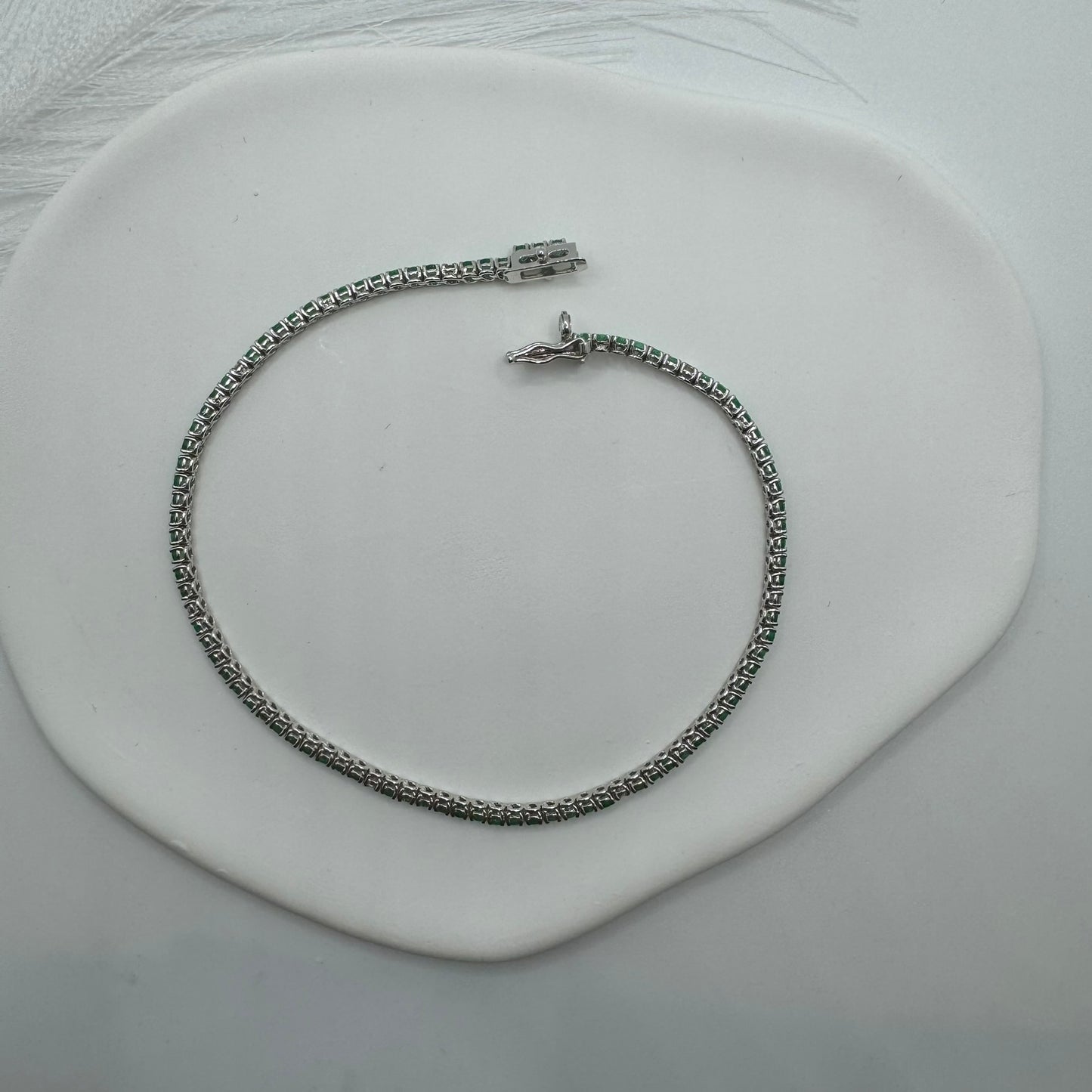Bracciale tennis smeraldi e diamanti oro