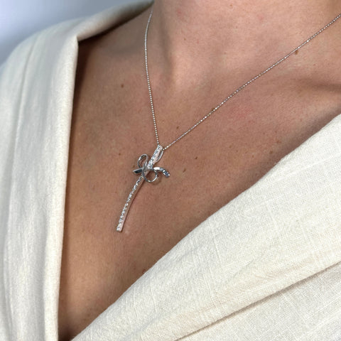 Collana pallinata con croce fiocco oro