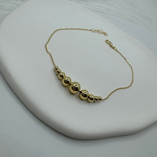 Bracciale rollò con sfere oro