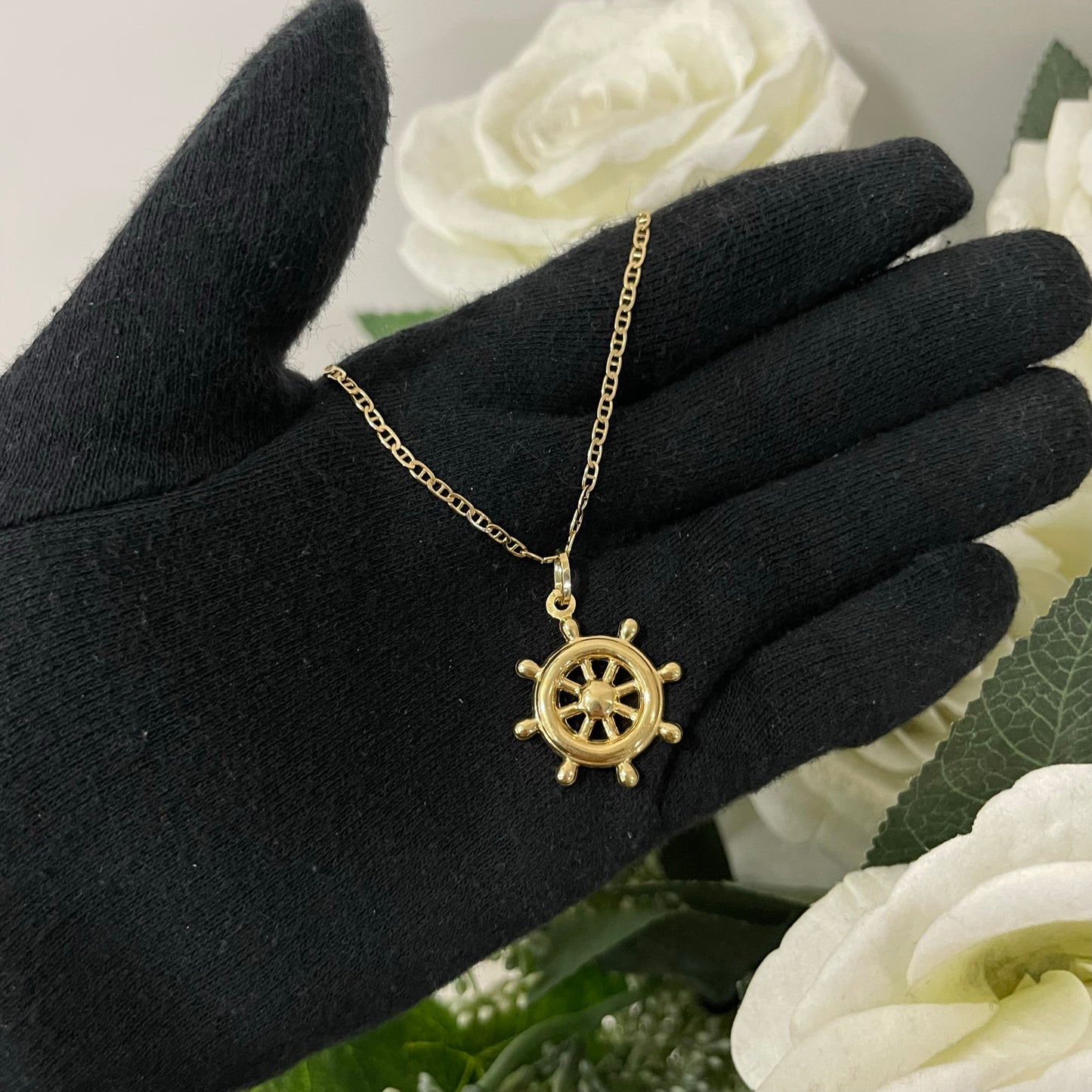 Collana traversina con timone oro